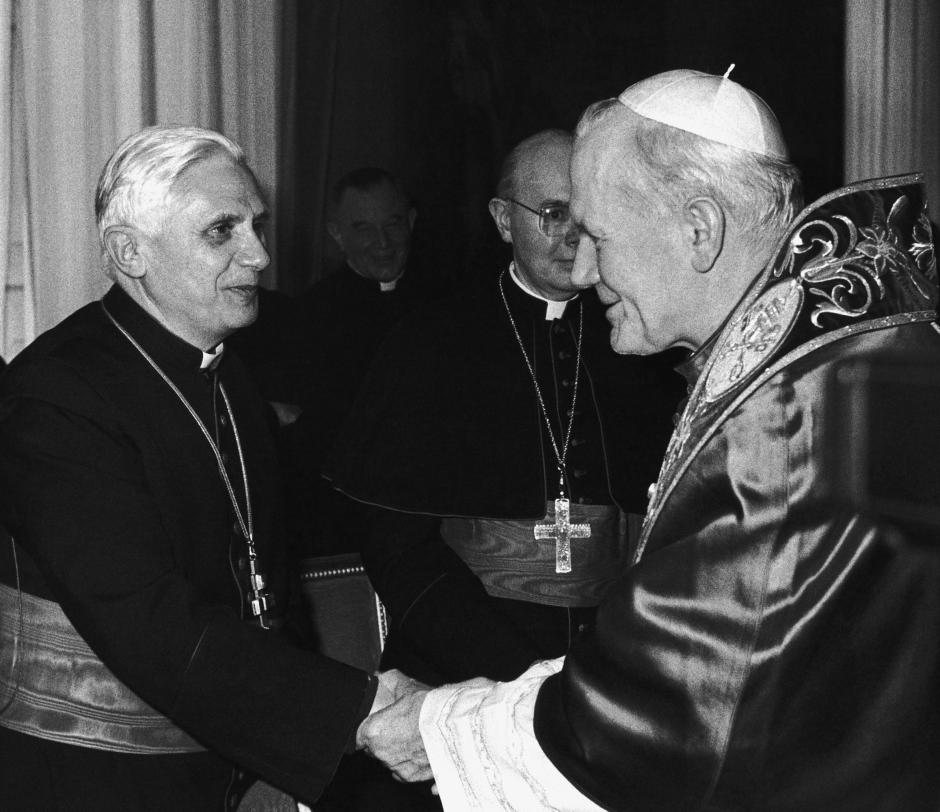 Pope John Paul II shakes hands with Cardinal Joseph Ratzinger, of Munich, Germany, during Christmas greetings in the Consistory Hall at the Vatican City on Thursday, Dec. 22, 1983.