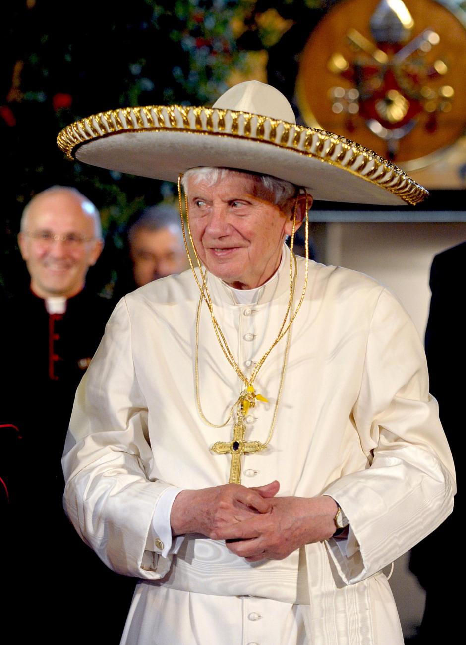 Pope Benedict XVI wears a Mexican hat in Leon, Mexico, Sunday, March 25, 2012.
