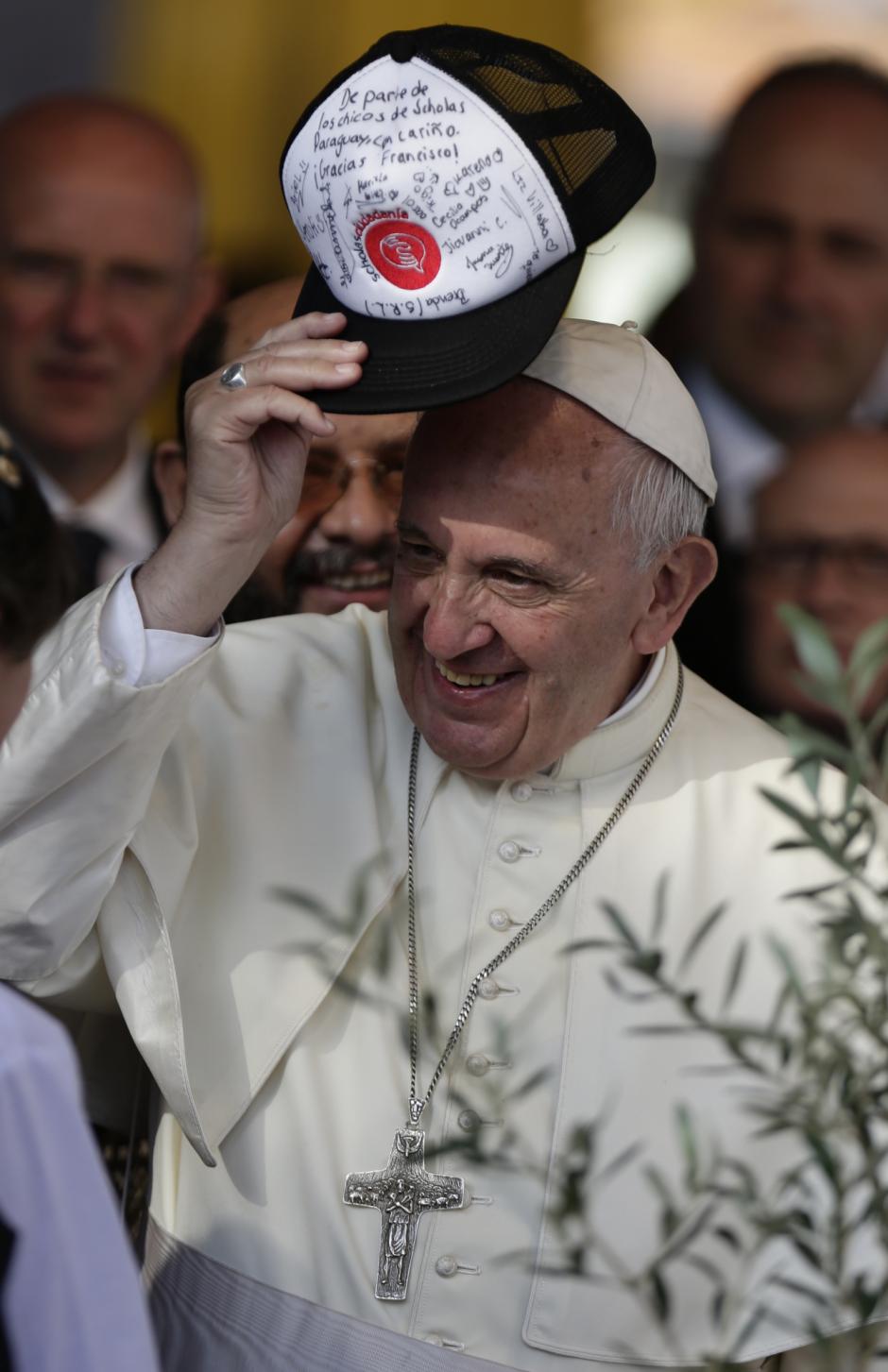 Pope Francis I Pope Francis puts on a cap of "Scholas Ocurrentes" in Asuncion, Paraguay, Sunday, July 12, 2015