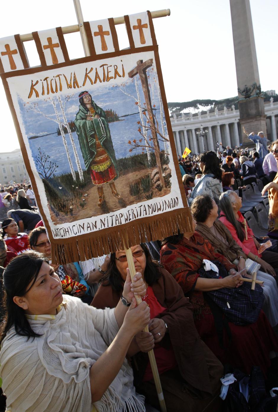 Native Indians from Quebec, Canada, hold an image of Kateri Tekakwitha, the first American Indian to achieve sainthood, as they wait for the start of a canonization ceremony celebrated in  the Vatican, Sunday, Oct. 21, 2012
