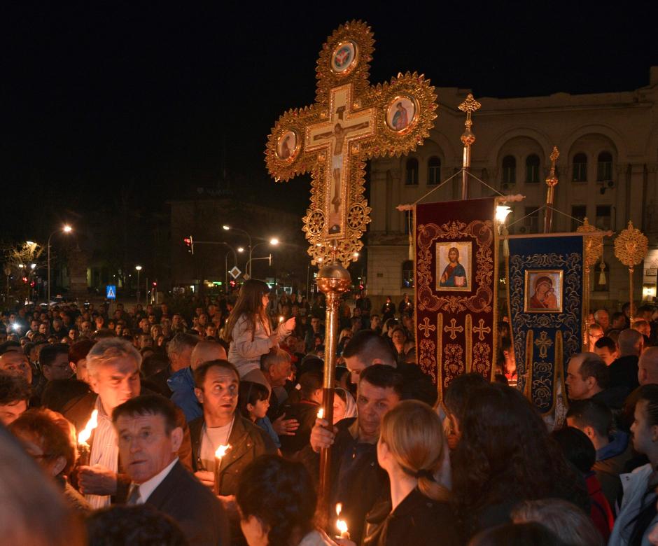 Bosnian Christian Orthodox believers hold candles during a procession at the Orthodox church in Bosnian town of Banja Luka, during Easter service, early Sunday, April 12, 2015.