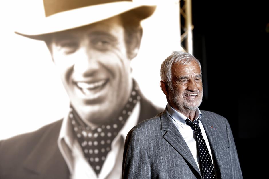 Actor Jean Paul Belmondo poses for photographers as he arrives at the opening ceremony of the 5th edition of the Lumiere Festival, in Lyon, central France, Monday, Oct. 14, 2013.