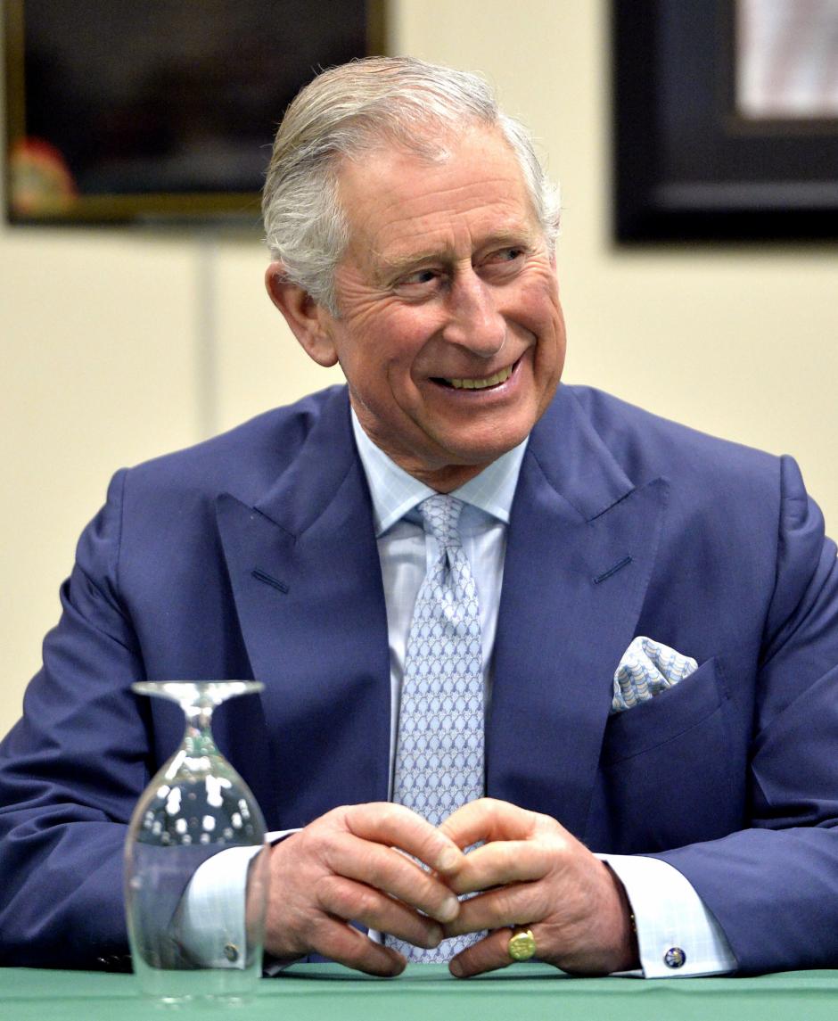 Britain's Prince Charles smiles as listens to a speaker during a roundtable discussion on agriculture at the Kentucky Center for African American Heritage in Louisville, Ky., Friday, March 20, 2015. (AP Photo/Timothy D. Easley, Pool)