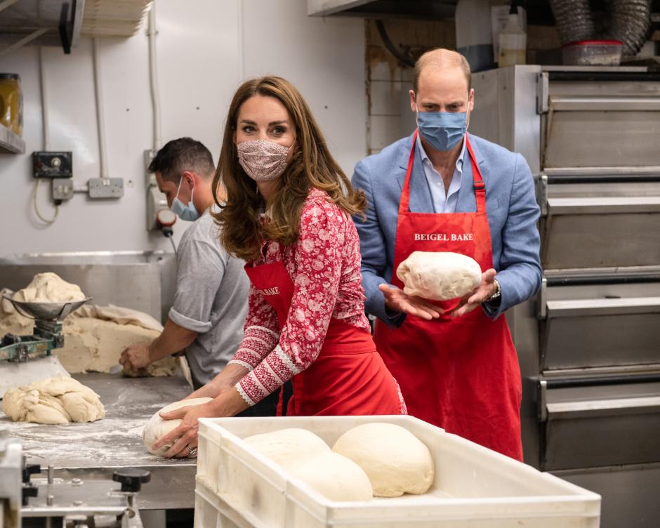 Prince Britian William and Kate Middleton, The Duke and Duchess of Cambridge help make bagels during a visit to the Beigel Bake Brick Lane Bakery in London. *** Local Caption *** .