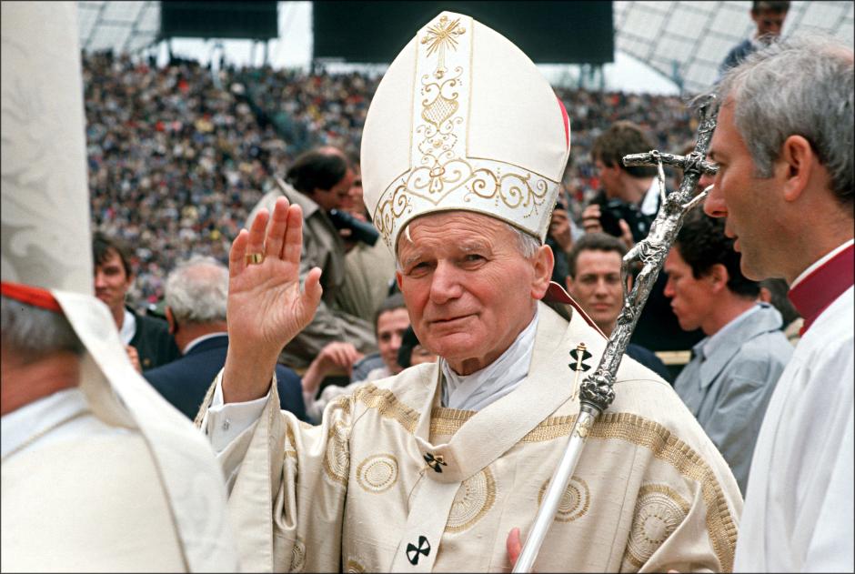 In this photo provided by the Vatican, Pope John Paul II gives the Easter blessing from the balcony of St. Peter's to the crowd gathered in St. Peter's Square on Easter in this Sunday, April 3, 1988 file photo.