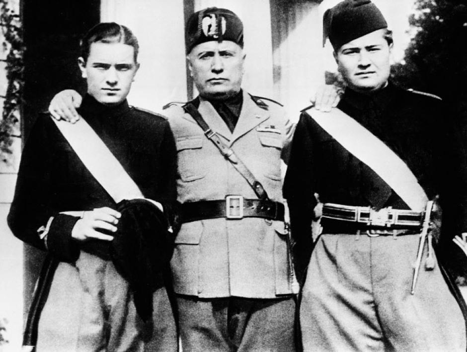 Italy's Premier Benito Mussolini, center, stands with an arm over the shoulders of his two sons, Bruno, left, and Vittorio during the young Fascists' Festival in Rome, Italy, March 14, 1935.  (AP Photo)