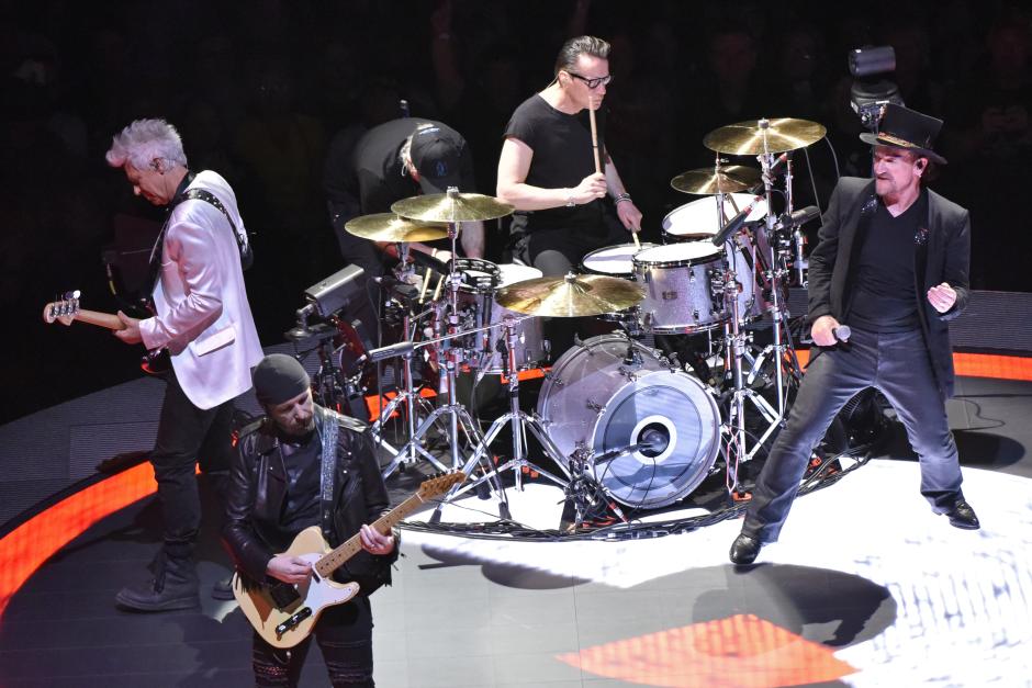 Bono, right, Adam Clayton, left, Larry Mullen Jr., second right, and The Edge, front, of U2 perform during the "Experience + Innocence" tour at the United Center on Tuesday, May 22, 2018, in Chicago.  *** Local Caption *** .