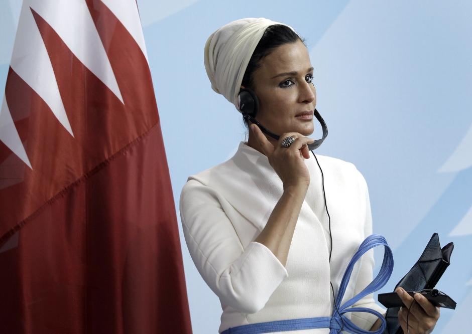Sheika Mozah bint Nasser al-Missned wears a translation headphone during a joint news conference after a meeting at the chancellery in Berlin, Germany, Wednesday, Sept. 29, 2010.