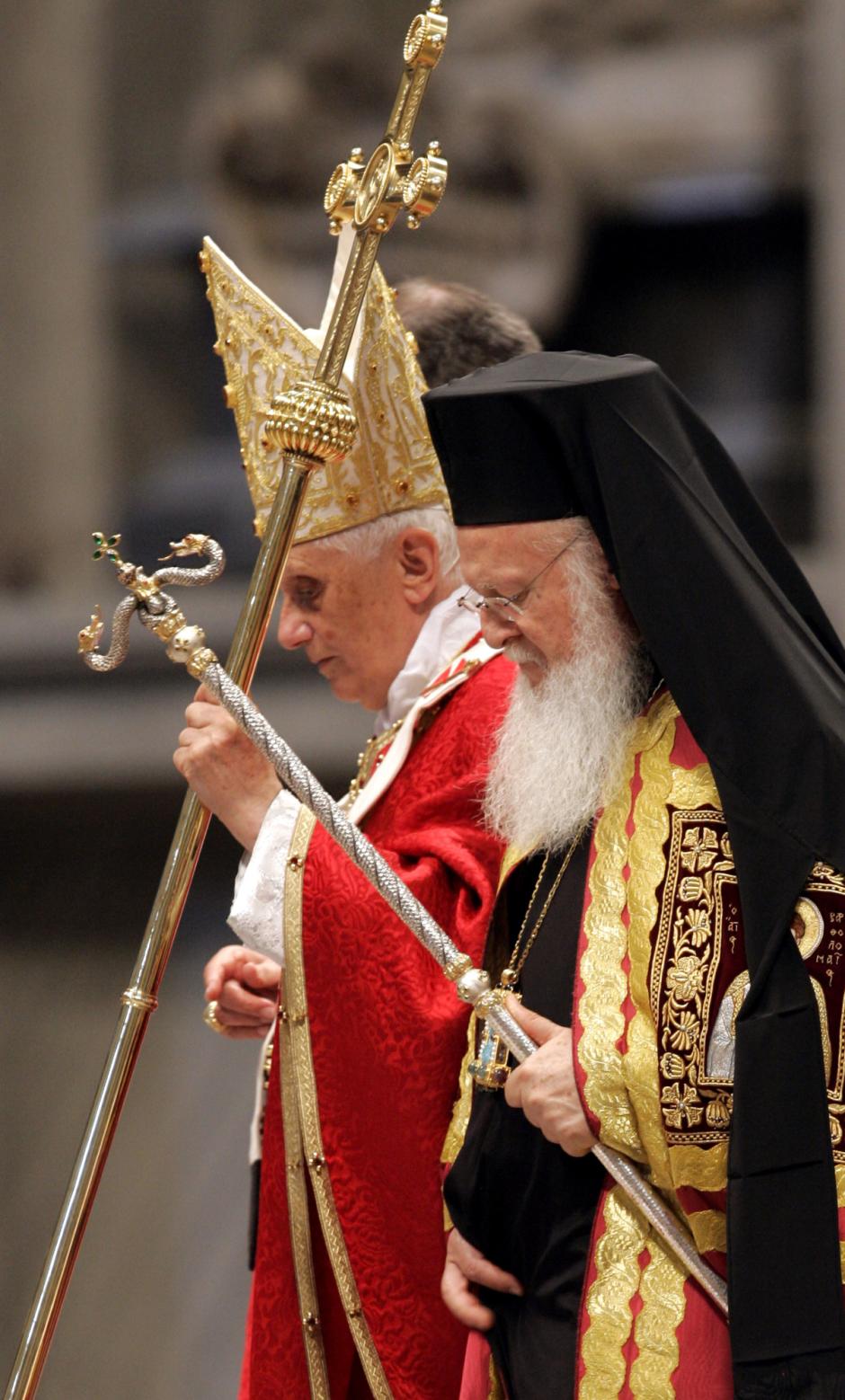 Pope Benedict XVI and Ecumenical Patriarch Bartholomew hold their staffs as they walk during a Mass celebrated in St. Peter's Basilica, Sunday, June 29, 2008. The Mass marking the feast of St. Peter and St. Paul esi:included readings from the Gospels in Latin and Greek by Catholic and Orthodox clerics. Benedict and Bartholomew also prayed together in Greek. (AP Photo/Pier Paolo Cito)