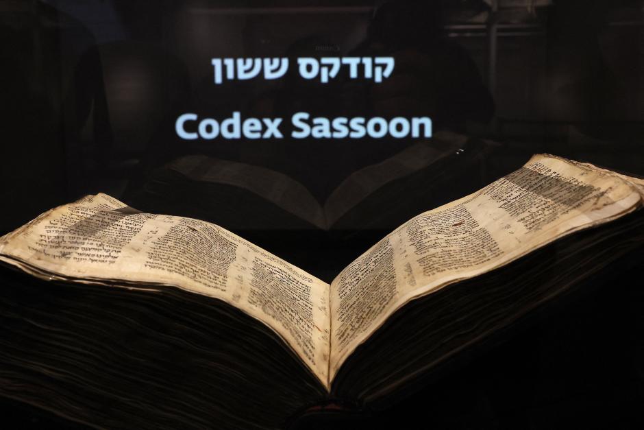 The Codex Sassoon, the earliest most complete edition of the Hebrew Bible, is pictured on March 22, 2023 at the ANU Museum of the Jewish People in Tel Aviv. - The manuscript, which is believed to be more than 1,000 years old, is set to be sold at auction in New York for up to an estimated $50 million. (Photo by JACK GUEZ / AFP)