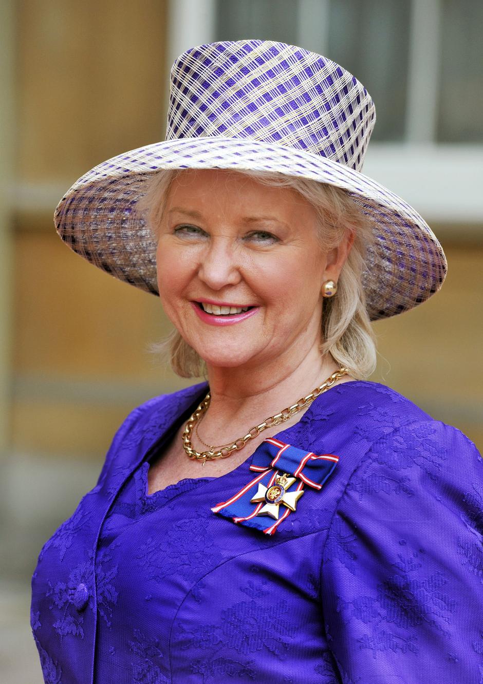 Angela Kelly  wears her Royal Victorian Order medal,  in central London.