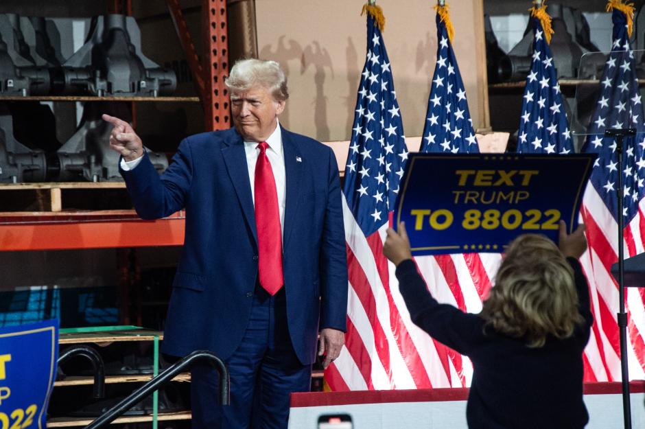 Former US President and 2024 presidential hopeful Donald Trump arrives to speak at Drake Enterprises, an automotive parts manufacturer and supplier, in Clinton, Michigan, on September 27, 2023. - Both Trump and Biden are visiting Michigan this week, in what is their first major skirmish of a long fight for voters in working-class swing states ahead of the November 2024 election. Biden on September 26, 2023, became the first sitting president to stand on a picket line, supporting calls by the United Auto Workers (UAW) union for the Big Three Detroit carmakers to raise wages. And Trump is skipping a debate in California with his trailing Republican rivals on September 27 to head instead for a small, non-union car parts factory on the other side of Detroit. (Photo by Matthew Hatcher / AFP)