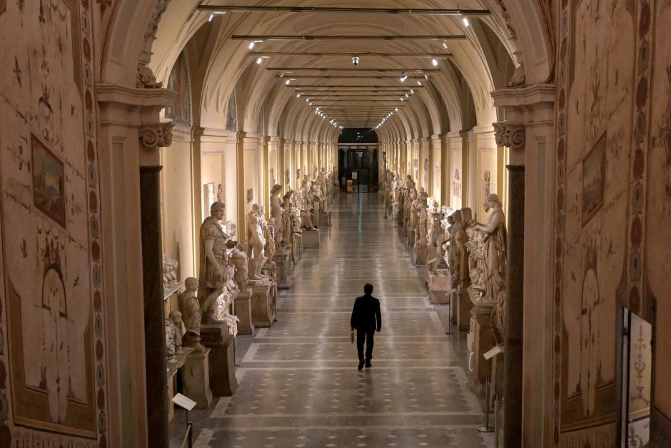 Gianni Crea, key keeper of the Vatican Museums, walks in the Round Hall during a private visit of the museums by night, early on February 13, 2024. (Photo by Tiziana FABI / AFP)