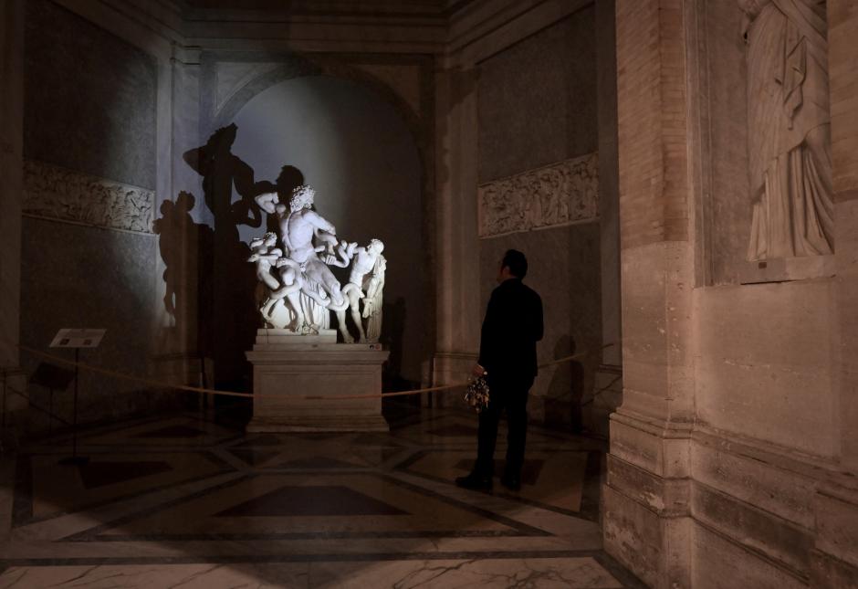 Gianni Crea, key keeper of the Vatican Museums, holds a big mast of keys as he walks in a gallery during a private visit of the museums by night, on February 13, 2024. (Photo by Tiziana FABI / AFP)