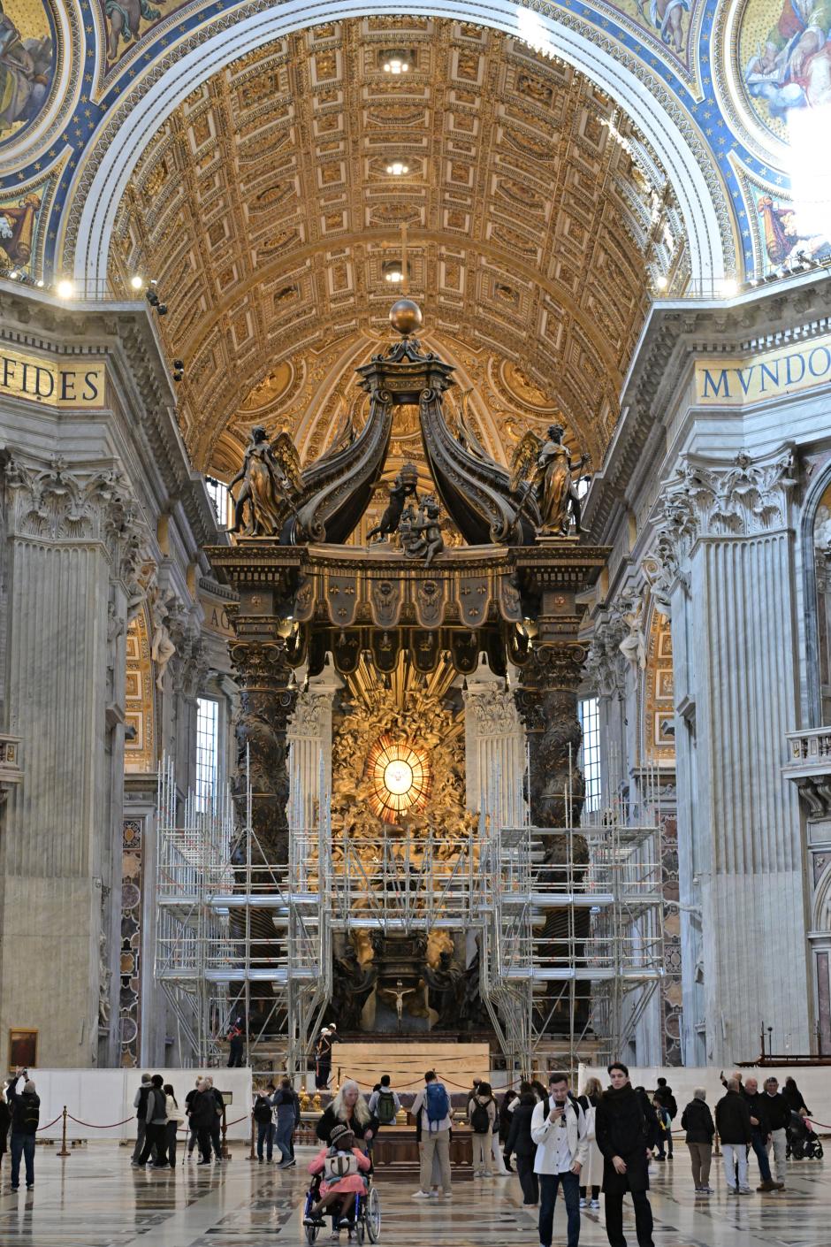Workers mount a scaffolding around the baldachin of St. Peter's basilica to start its restoration on February 21, 2024 in the Vatican. The large Baroque sculpted bronze canopy over the high altar of St. Peter's Basilica by artist Gian Lorenzo Bernini dated from 1634. (Photo by Andreas SOLARO / AFP)