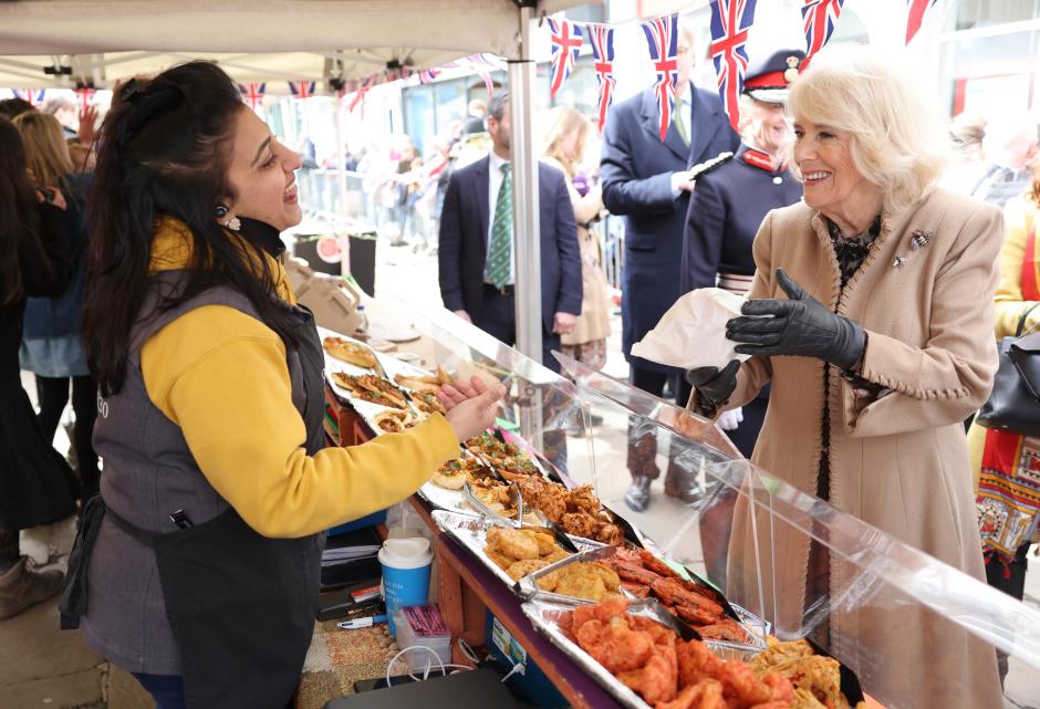 Queen Camilla smiles as she meets a market trader during a visit to the Farmers' Market in The Square, Shrewsbury, in Shropshire. Picture date: Wednesday March 27, 2024.