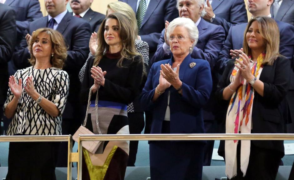 Jordanian Queen Rania 2nd (L) and King Abdullah II's mother Princess Muna al-Hussein (2nd R) claps at the opening.