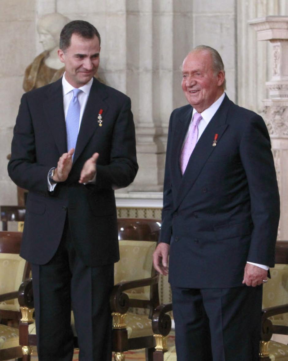 Spanish King Juan Carlos I and Crown Prince Felipe of Borbon during  the signing of the abdication law of Spain King Juan Carlos at the Royal Palace of Madrid on Wednesday 18th June 2014