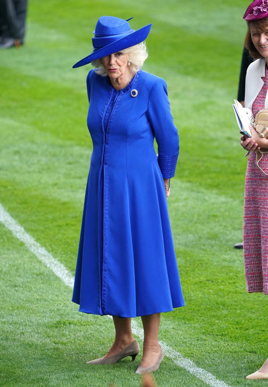 Queen Camilla stands in the parade ring ahead of the King Charles III Stakes on day one of Royal Ascot at Ascot Racecourse, Berkshire. Picture date: Tuesday June 18, 2024. *** Local Caption *** .