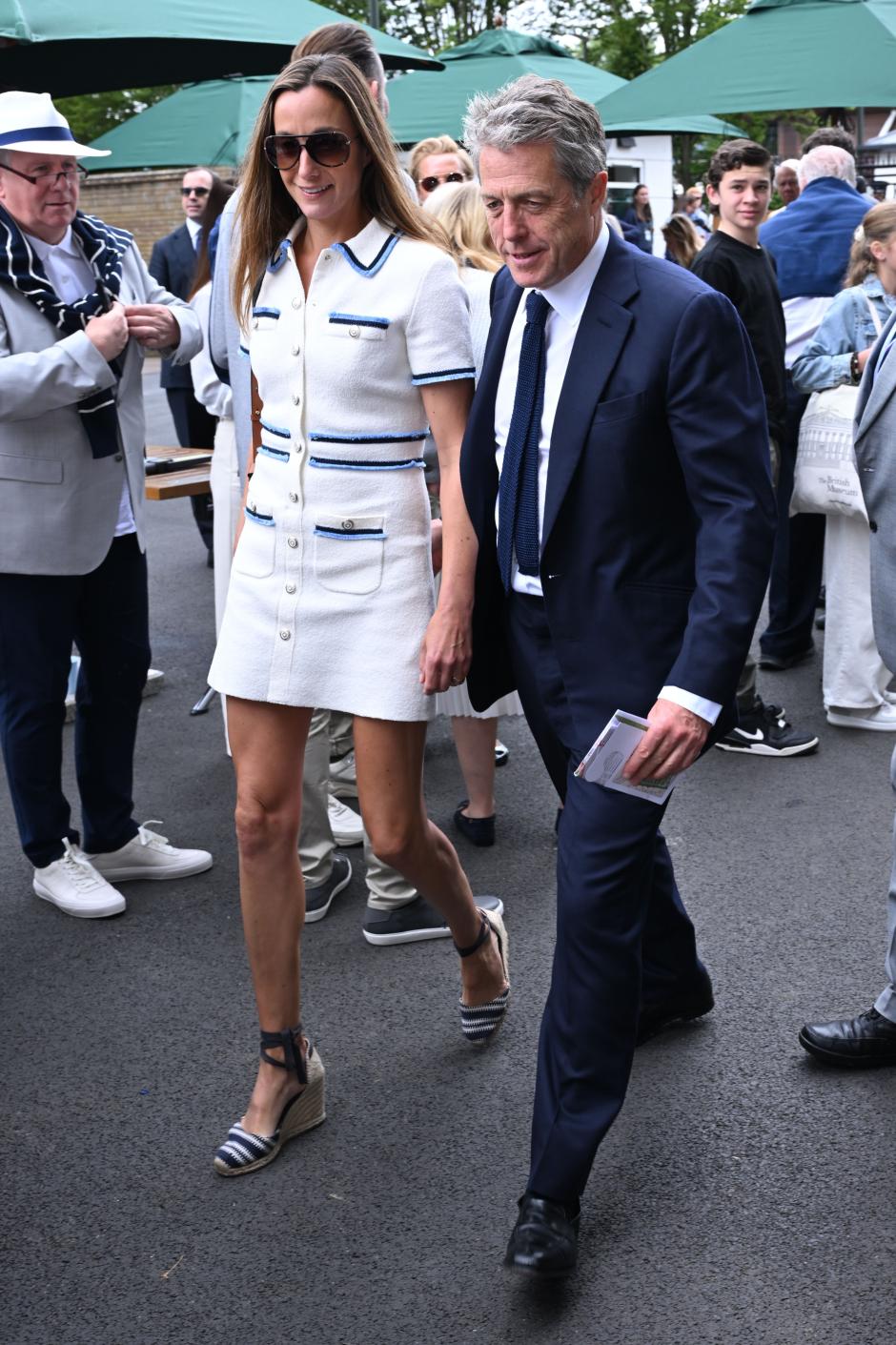 Actor Hugh Grant and Anna Eberstein during Wimbledon 2024 London. Picture date: Friday July 12, 2024. *** Local Caption *** .