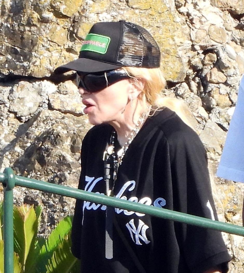 BGUK_2998405 - Portofino, ITALY  - The Legendary American Singer/Songwriter Madonna spotted out in the Italian sunshine arriving at Dolce and Gabbana's Portofino Villa with her new mystery man.

The 65-year old showed off her cool side, wearing her New York Yankee top, sunglasses and cap as she arrived in style via a boat as the 'Queen of Pop' was helped ashore by her entourage as she spends her holidays at the designers pad with her mystery beau.

Pictured: Madonna

BACKGRID UK 11 AUGUST 2024 

BYLINE MUST READ: COBRA TEAM / BACKGRID

UK: +44 208 344 2007 / uksales@backgrid.com

USA: +1 310 798 9111 / usasales@backgrid.com

*Pictures Containing Children Please Pixelate Face Prior To Publication* *** Local Caption *** .