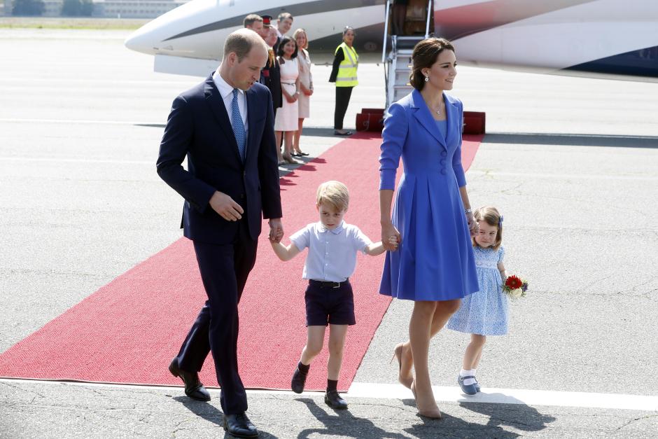 Britain's Prince William, his wife Kate Middleton and their children Prince George and Princess Charlotte arrive at Tegel Airport in Berlin, Germany, 19 July 2017