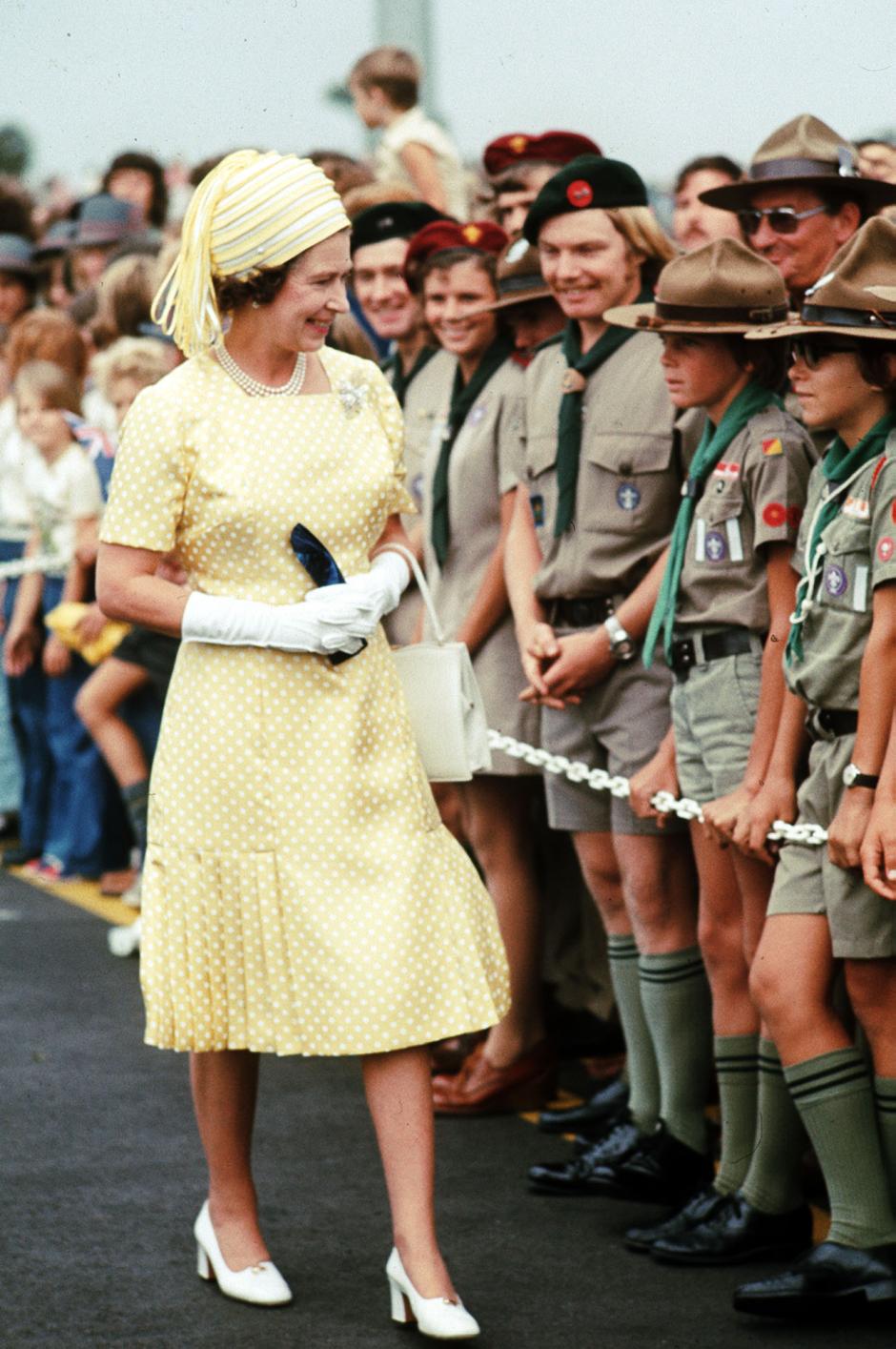 Queen Elizabeth II meets boy scouts on arrival at Brisbane, during her Silver Jubilee tour of Australia.