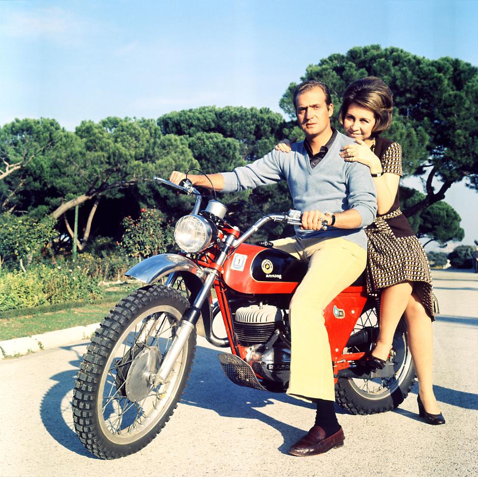 King Juan Carlos as Prince with his wife Princess  Sofia riding his motorbike in the grounds of ZarzuelaPalace, Madrid, Spain