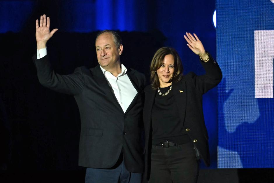 US Vice President and Democratic presidential candidate Kamala Harris and US Second Gentleman Doug Emhoff wave at supporters at the end of a campaign rally on the Benjamin Franklin Parkway in Philadelphia, Pennsylvania on November 4, 2024. (Photo by ANGELA WEISS / AFP)