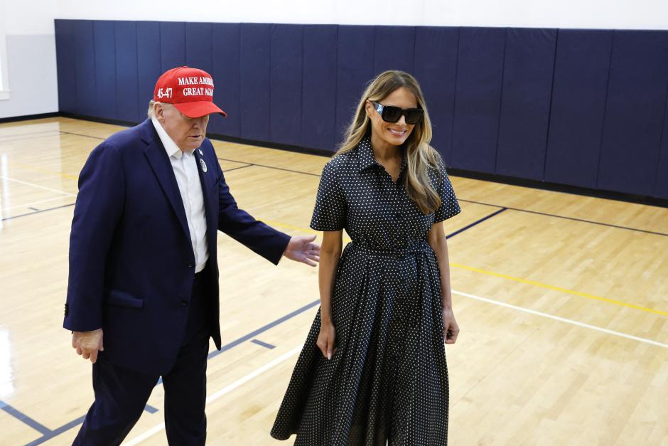 PALM BEACH, FLORIDA - NOVEMBER 05: Republican presidential nominee former President Donald Trump escorts his wife Melania Trump at the polling place in the Morton and Barbara Mandel Recreation Center on Election Day, on November 05, 2024 in Palm Beach, Florida. Trump will hold an Election Night event at the Palm Beach Convention Center.   Chip Somodevilla/Getty Images/AFP (Photo by CHIP SOMODEVILLA / GETTY IMAGES NORTH AMERICA / Getty Images via AFP)