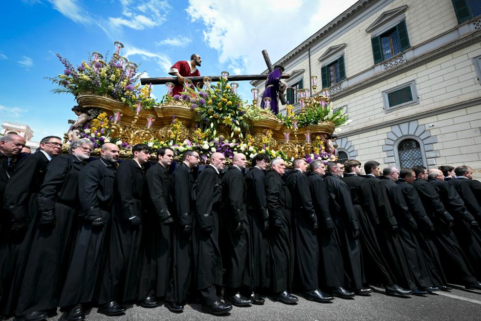 Members of a Spanish confraternity of the Christ of Nazareth take part in a procession as part of the Jubilee of Confraternities, in Rome on May 17, 2025. (Photo by Stefano Rellandini / AFP)