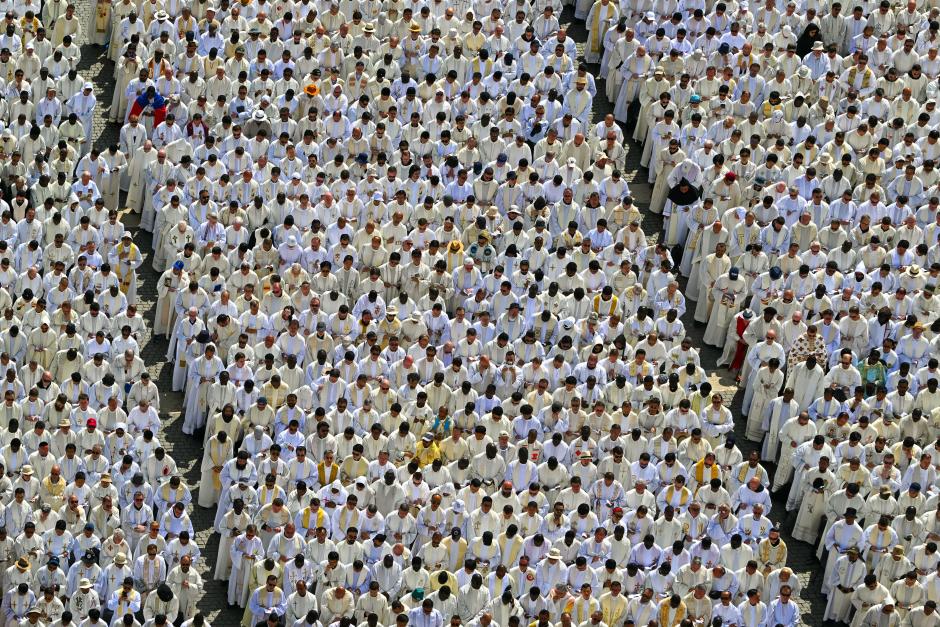 Priests attend a Holy Mass for the Beginning of the Pontificate of Pope Leo XIV, in St Peter's square in The Vatican on May 18, 2025. (Photo by Alberto PIZZOLI / AFP)