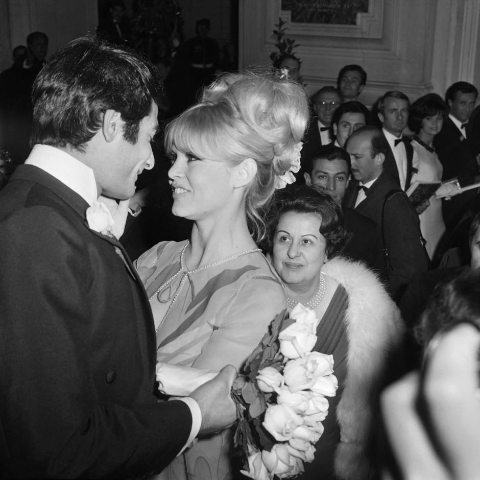 (FILES) French actor Jean-Claude Brialy welcomes French actress Brigitte Bardot  during the French artists Union Gala event at the Opera Garnier in Paris on March 19, 1966. French actress Brigitte Bardot died at 91 AFP learned from Bardot foundation on December 28, 2025. (Photo by AFP)