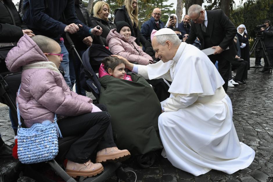 Pope Leo XIV greets German girls wearing traditional clothes at the end of his weekly general audience at the Paul VI hall in the Vatican on February 11, 2026. (Photo by Alberto PIZZOLI / AFP)
