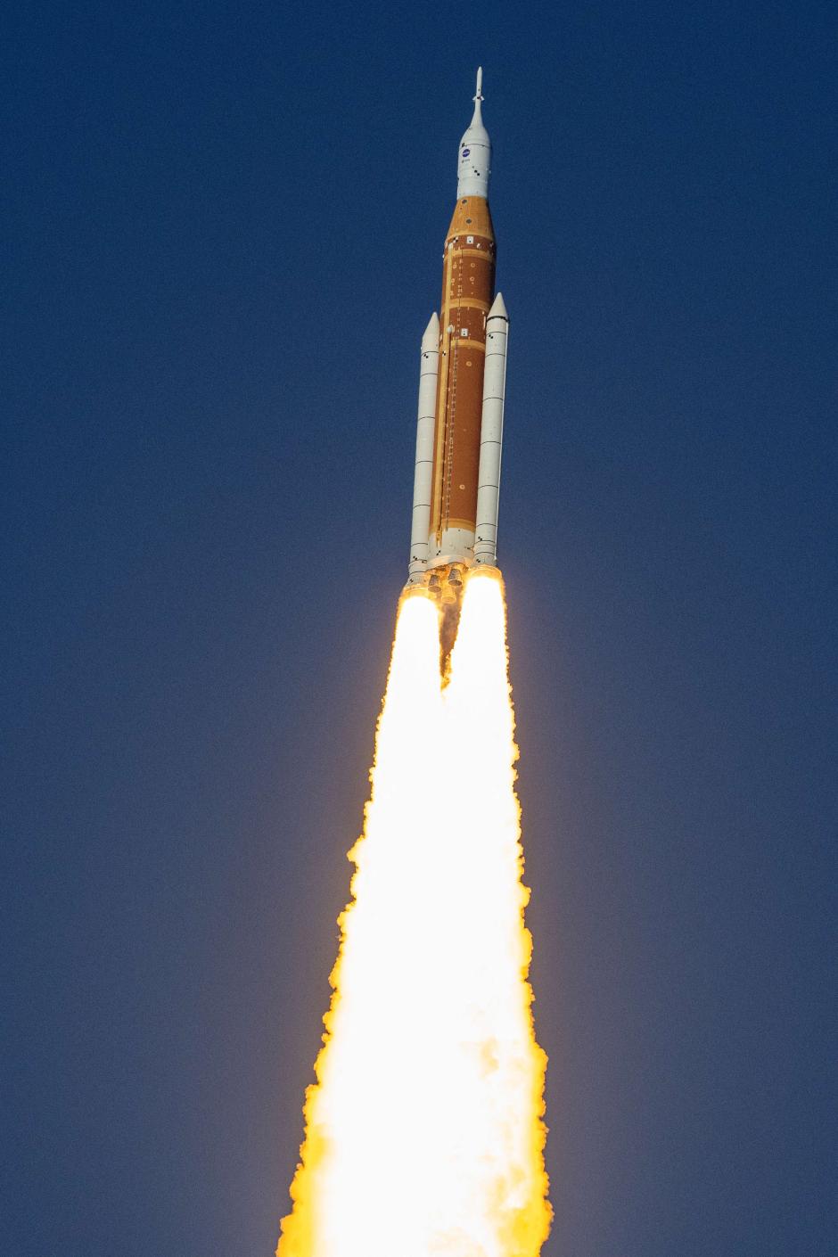 The Artemis II crewed lunar mission launches at Kennedy Space Center in Cape Canaveral, Florida, on April 1, 2026. Artemis II is a 10-day flight with four astronauts on a loop around the Moon, marking the first time humans have traveled beyond low Earth orbit since the Apollo 17 mission in 1972. (Photo by Jim WATSON / AFP)