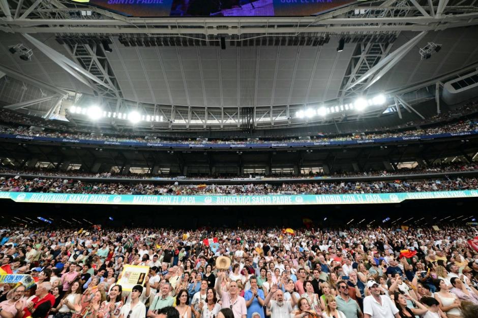 Spectators cheer as Pope Leo XIV arrives at Real Madrid's Santiago Bernabeu stadium in Madrid on June 8, 2026. Pope Leo XIV is visiting Spain June 6-12 with stops in Madrid, Barcelona, and the Canary Islands, where he will meet with migrants and organisations dedicated to helping them. (Photo by Stefano RELLANDINI / AFP)