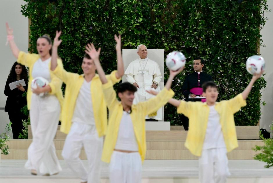 Pope Leo XIV watches a performance as he meets the diocesan community at Real Madrid's Santiago Bernabeu stadium in Madrid on June 8, 2026. Pope Leo XIV is visiting Spain June 6-12 with stops in Madrid, Barcelona, and the Canary Islands, where he will meet with migrants and organisations dedicated to helping them. (Photo by Stefano RELLANDINI / AFP)